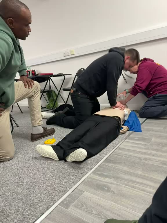 Delegates practising CPR on a manikin during an AV Group UK first aid course